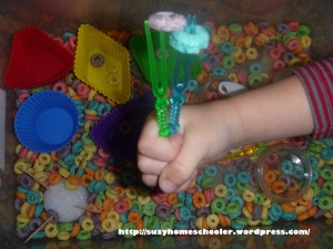25 Fruit Loop Activities from Suzy Homeschooler, sensory bin (serving fork)